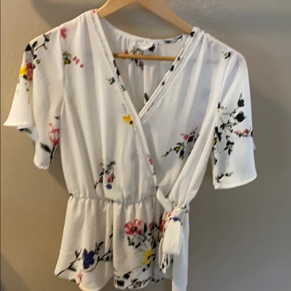 White top with flower designs